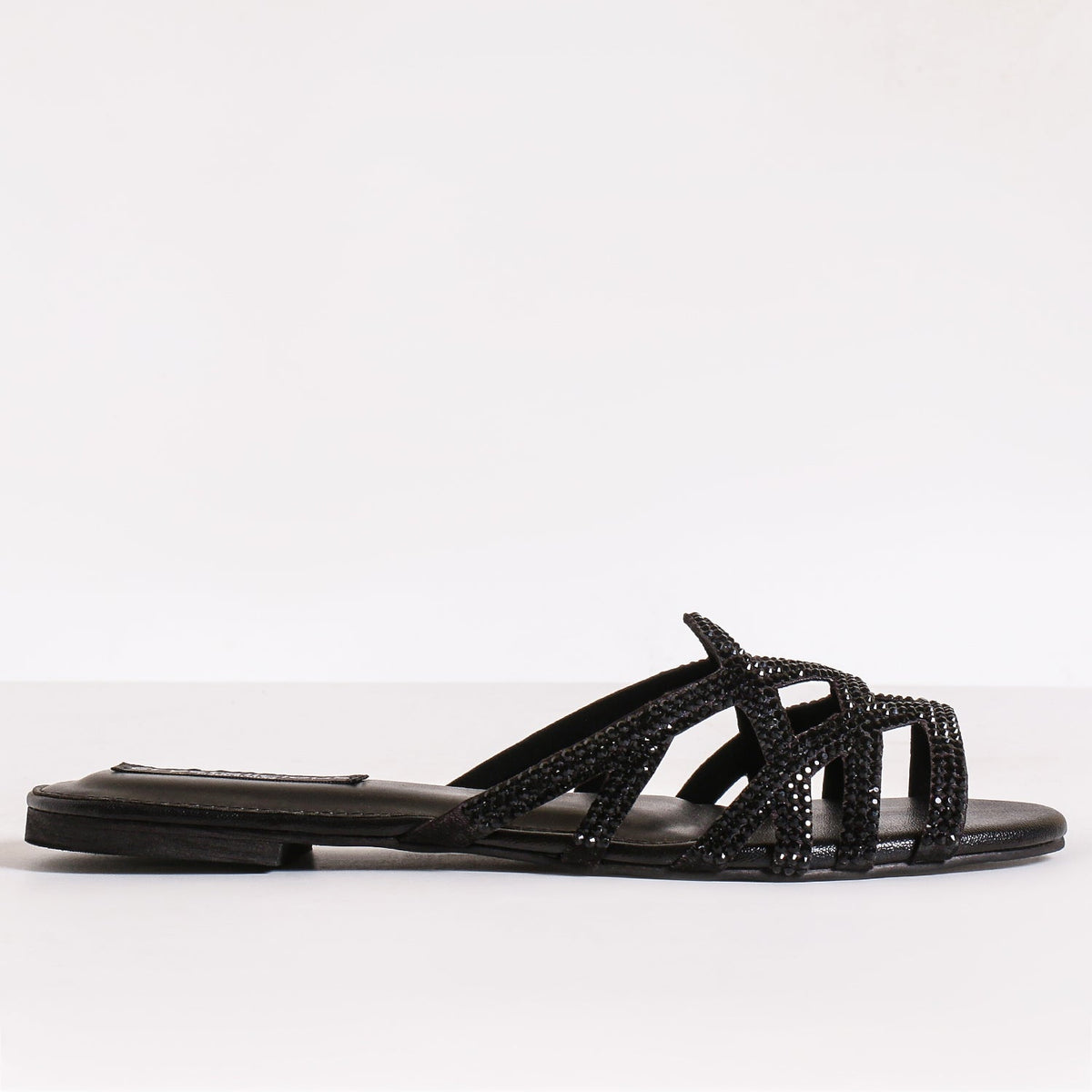 Crystalicious black embellished strappy sandals for women β handcrafted luxury footwear with intricate beadwork and elegant open-toe design. Perfect for evening wear and special occasions.